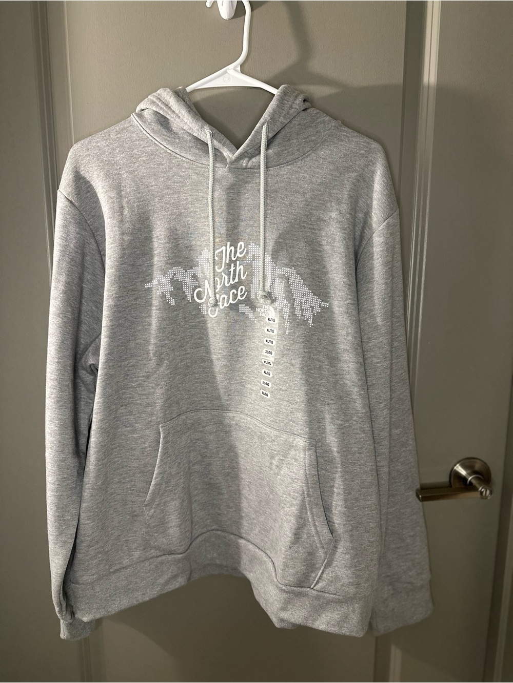 The North Face Woman’s Light Gray Pullover Hoodie with White Logo
